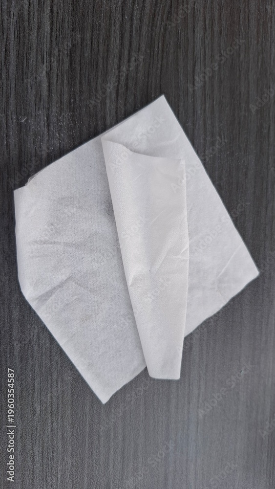 Obraz premium White Folded Tissue Paper on Dark Background
