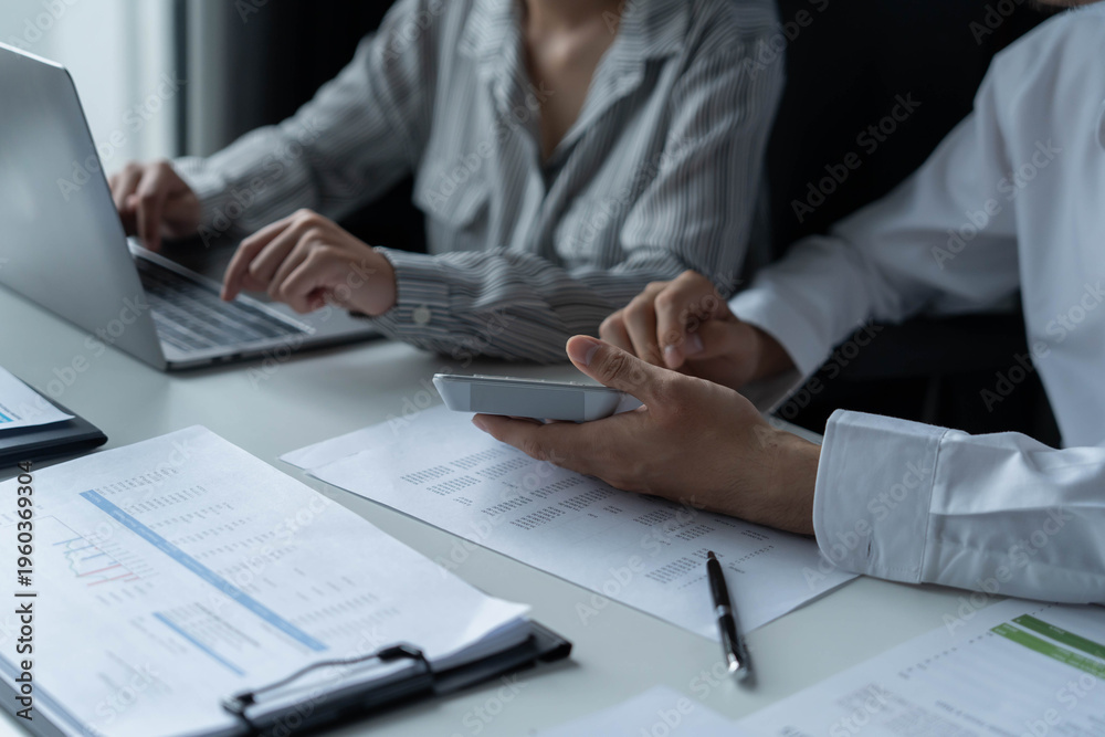 Fototapeta premium Businessman and businesswoman working together in an office