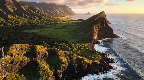 Maui coastline with rugged cliffs, lush greenery, and the pacific ocean at sunset