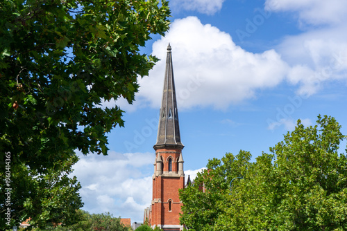 The historic 1891 Methodist Church building, now housing the Dear Abbey Restaurant, featuring Victorian Gothic stone architecture and a prominent spire in moonee ponds Victoria, Australia