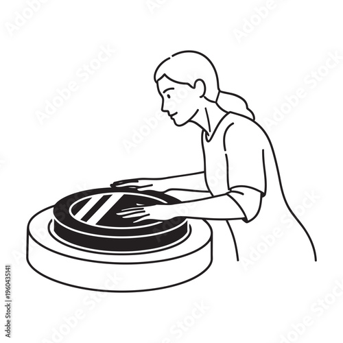A woman is working on a pottery wheel