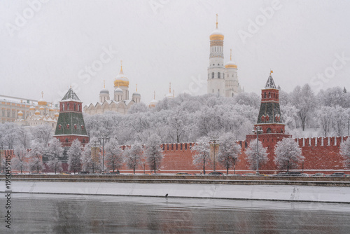 Architectural ensemble of the Moscow Kremlin from the embankment of the Moskva River during heavy snowfall, Moscow, Russia