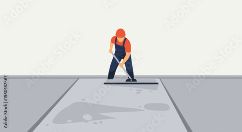 Worker Smooths Wet Concrete During Construction Project