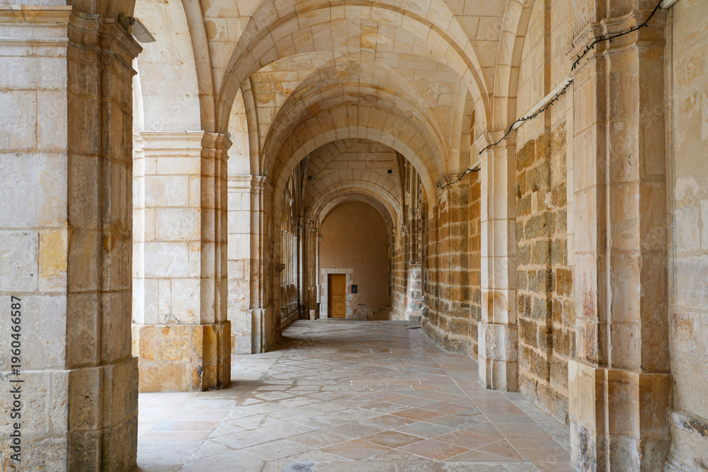Obraz premium Historic stone cloister and vaulted hallway of Saint-Germain Abbey in Auxerre, Burgundy, France
