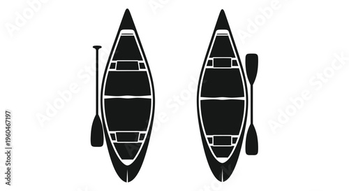 Two black canoes with paddles viewed from directly above