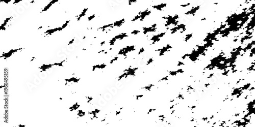 Abstract an extreme close-up monochromatic shot that shows a textured surface with black speckles and smudges, reminiscent of a vintage or weathered aesthetic.