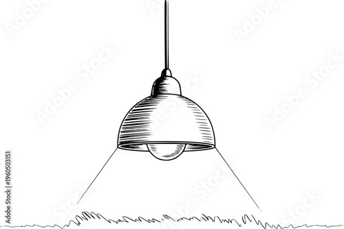 Black and white of a hanging industrial lamp illuminating scribbled grass below light