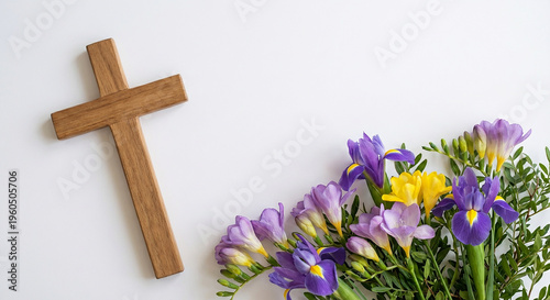 Wooden cross with beautiful purple freesia bouquet on white background perfect for Christian faith religious concept and elegant memorial service