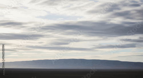 Mountain under cloudy sky landscape.