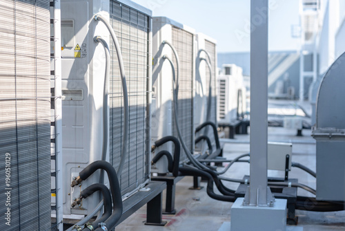 Cuadro en lienzo Row of industrial air conditioning units on a building rooftop, External hvac sy