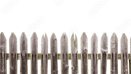 фотографія Weathered rustic wooden picket fence featuring aged grey planks and visible grai