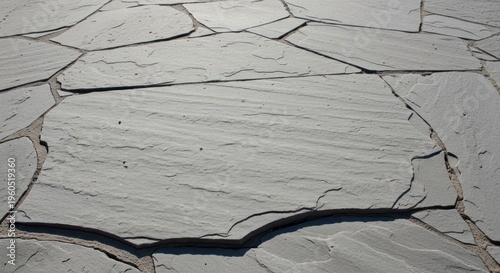 Gray slate stone pavement surface.