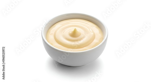A small white bowl filled with creamy mayonnaise or butter on a plain white background smooth texture