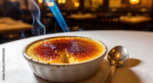 Crème Brûlée Being Torched In A Restaurant Setting With A Caramelized Sugar Top And Creamy Custard
