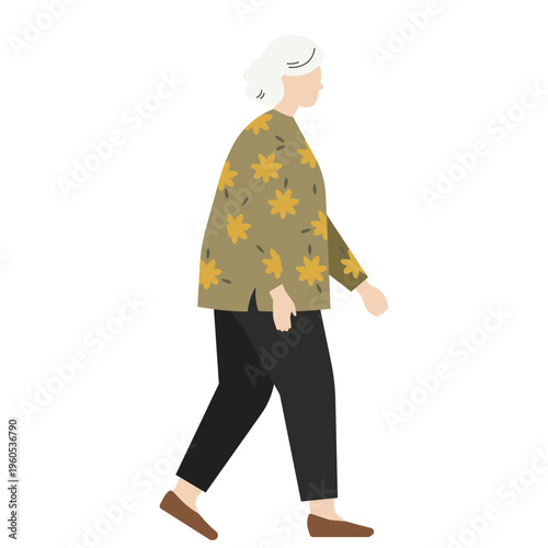 黄色い花柄のトップスを着て歩く白髪のおばあちゃん