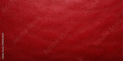 A dark red textured leather background featuring a vintage grunge material surface with a macro pattern of rough skin textile for a blank wallpaper design