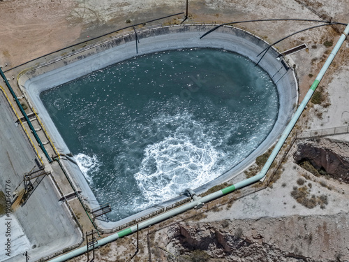 Slika na platnu Aerial view of a concrete pond for sedimentation and treatment of mine wastewate