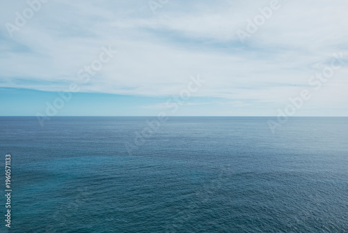 View of the ocean with blue tones and a smooth water texture