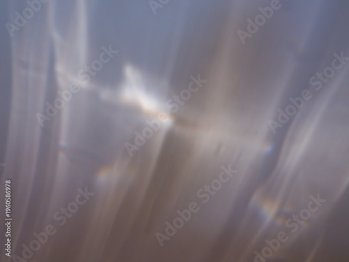Ethereal abstract macro reflection with soft, fluid light patterns. A serene and dreamy background perfect for wellness, meditation, and high-end lifestyle branding.