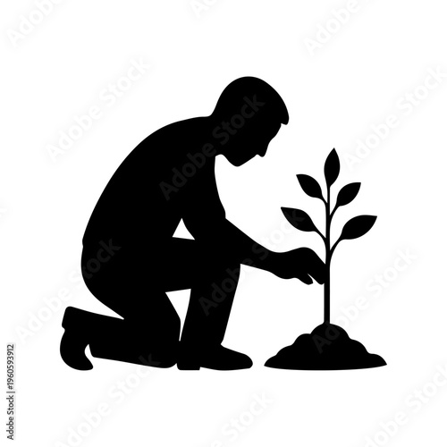 Adult man planting young trees, representing nature conservation and environmental care