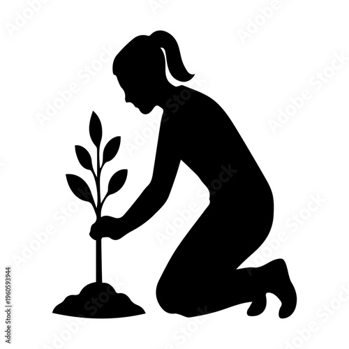 Adult woman planting young trees, representing nature conservation and environmental care