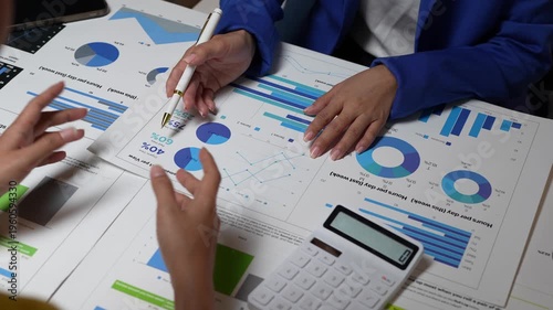 Colleagues analyzing business financial data charts