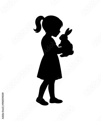 Girl silhouette holding rabbit showing childhood innocence