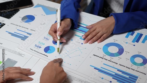 Business people analyzing financial data charts and graphs