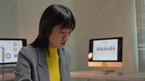 Asian businesswoman working late in the office