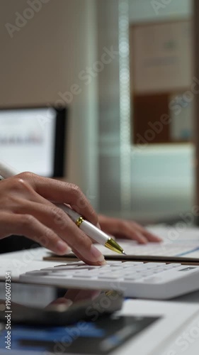 Accountant calculating business finances on desk