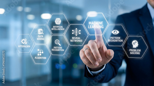 Professional hand pointing at machine learning on a futuristic digital display in a modern tech offi