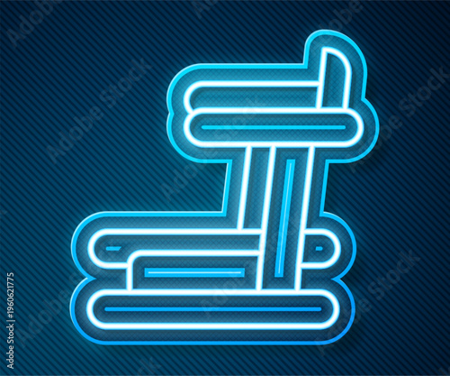 Glowing neon line Treadmill machine icon isolated on blue background. Vector