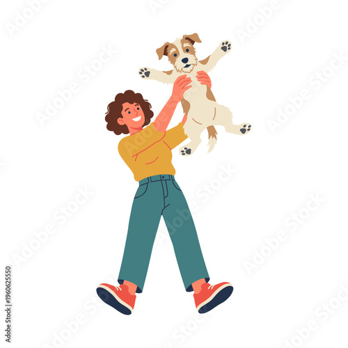 Woman playfully lifts happy dog in air with joyful expression outdoors