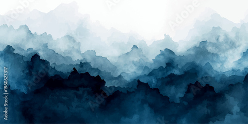 An aerial view of the cold blue alps peak captures a misty mountain landscape where sun and clouds meet over a fog-covered valley at sunrise