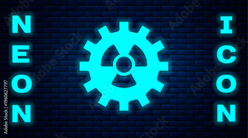 Glowing neon Radioactive icon isolated on brick wall background. Radioactive toxic symbol. Radiation hazard sign. Vector