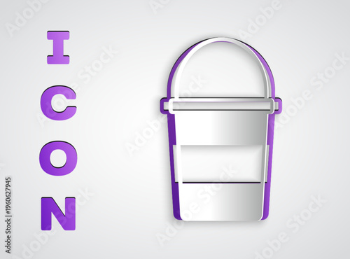 Paper cut Fire bucket icon isolated on grey background. Metal bucket empty or with water for fire fighting. Paper art style. Vector