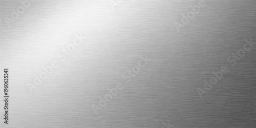 Industrial stainless steel plate with a brushed metallic texture featuring a shiny silver alloy surface and gray aluminum pattern for a professional material background