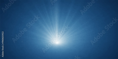Bright sun rays burst through the clear blue sky in a glowing summer sunburst creating a natural light flare backdrop of pure sunshine energy