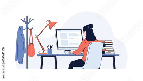 Focused woman works at her desk with a computer and stacks of books in a quiet home office or library setting with a lamp.