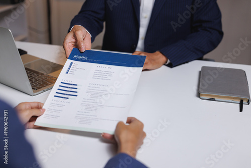 Tableau sur toile Applicant submitting resume to interviewer during hiring process