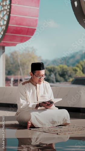 A Muslim man performing Islamic pray inside a mosque during Ramadan, a peaceful spiritual moment with beautiful mosque architecture.