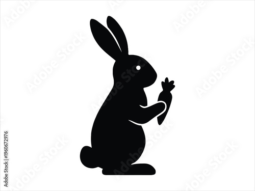 A minimalist black silhouette illustration of a cute rabbit holding a fresh orange carrot snack