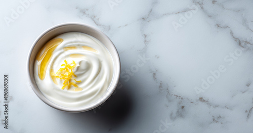 Bowl of yogurt with honey and lemon zest