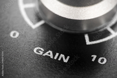 Macro shot with selective focus of volume encoder knob on audio interface