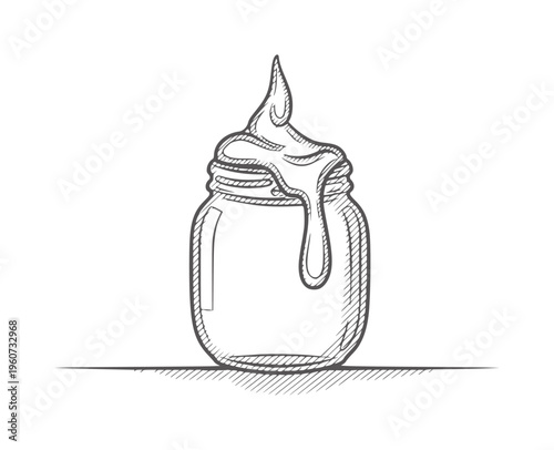 Of honey dripping from a jar onto a surface liquid sweet