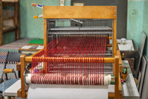 Rhythmic loom creates a vibrant tapestry, workshop and crafts