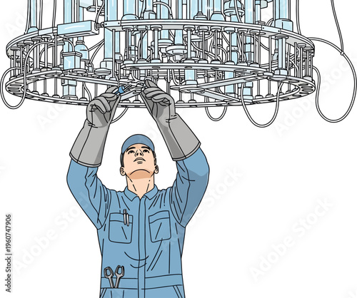 Man in blue overalls working on industrial equipment