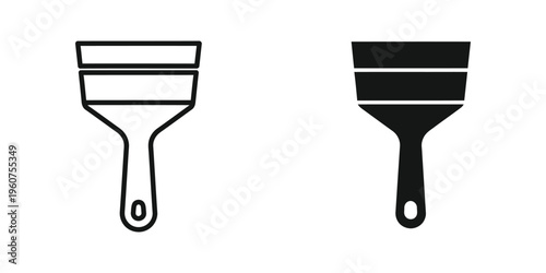 Comparison of a white and black trowel for construction or painting tasks