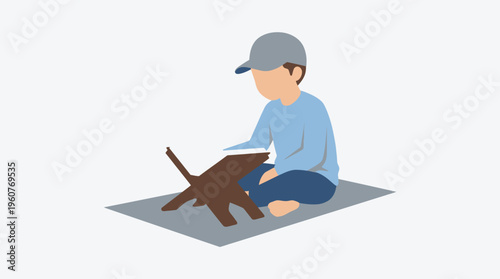 A young boy sitting on a mat, reading a book placed on a wooden stand, engaged in study or religious learning.