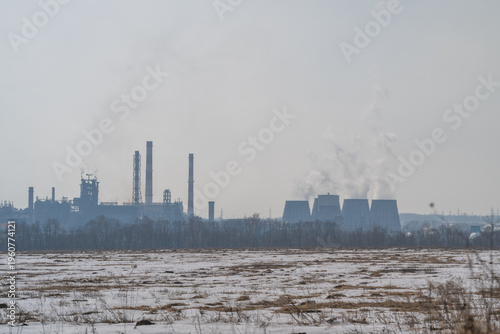 Принти на полотні Cooling towers and steam clouds at metallurgical plant dominate horizon, power a
